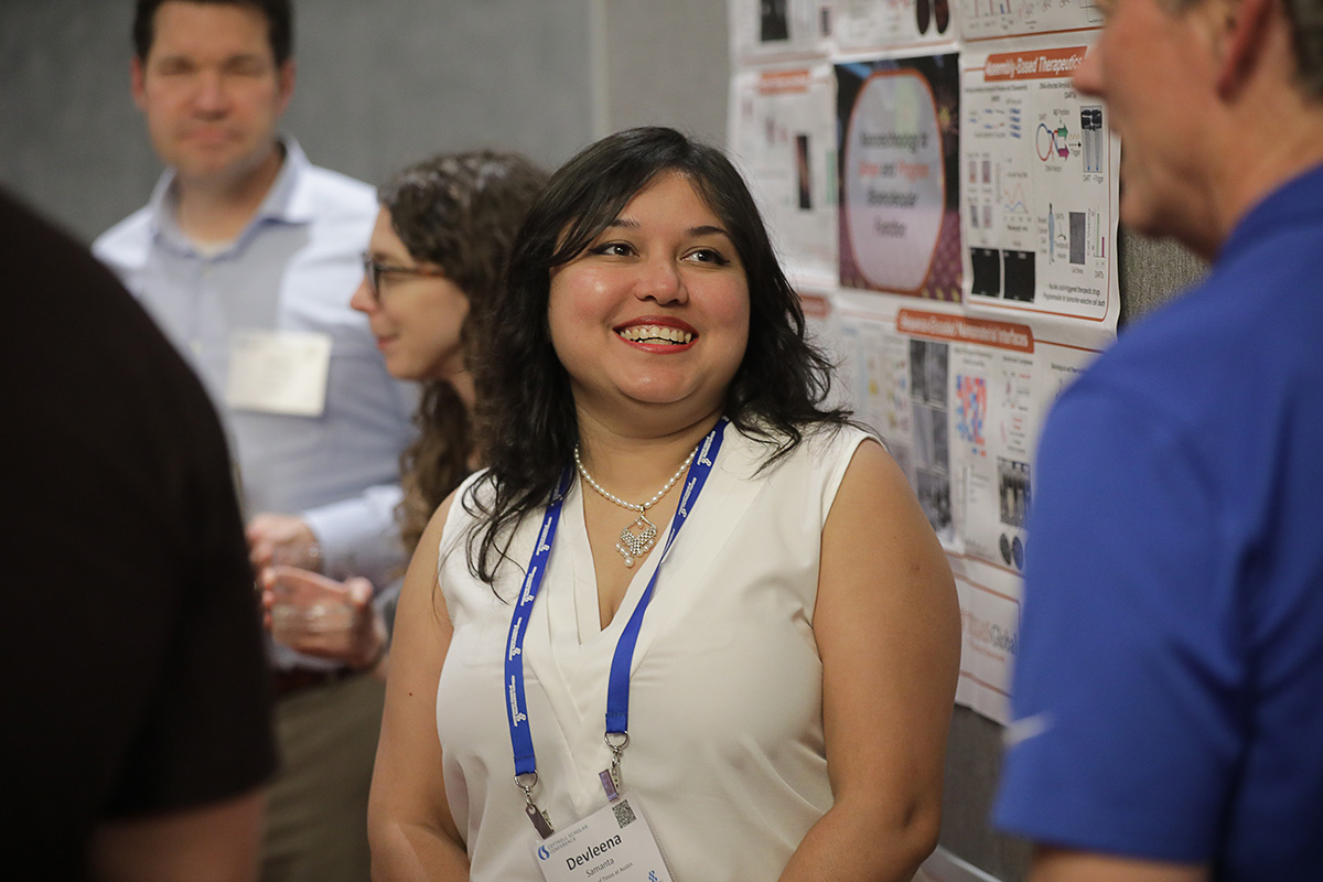 a person smiles at another person at the 2026 Cottrell Scholars Conference